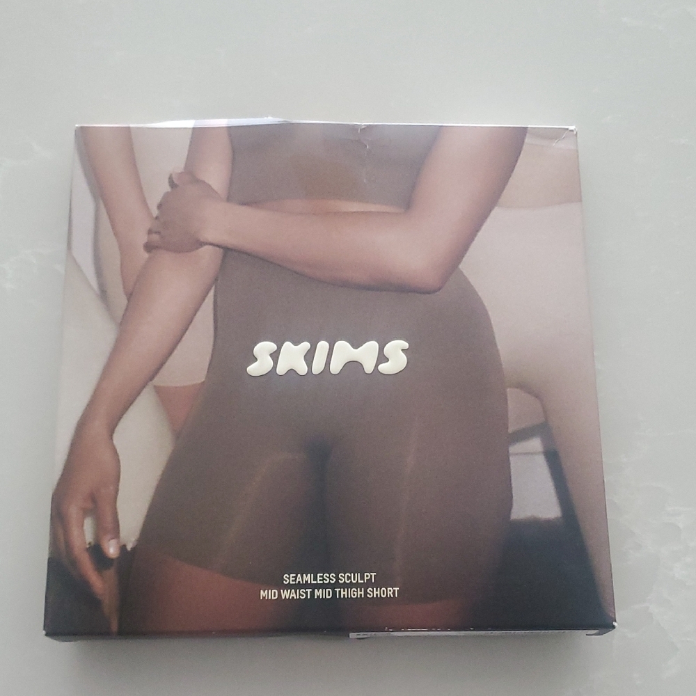 SKIMS Sculpting Mid Thigh Shorts in Brown